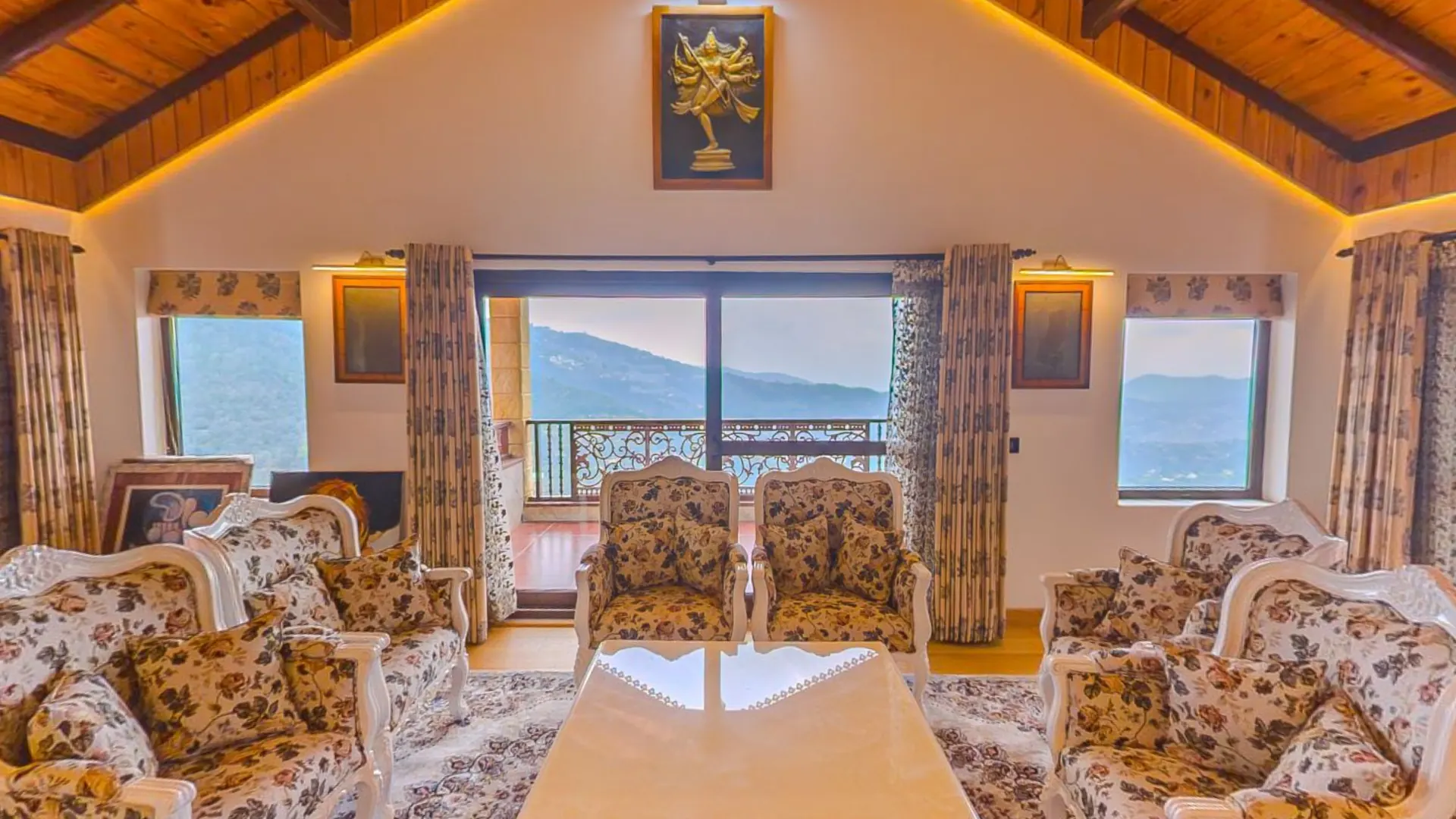 Upper-floor lounge at The Mukteshwar Bungalow with Himalayan views